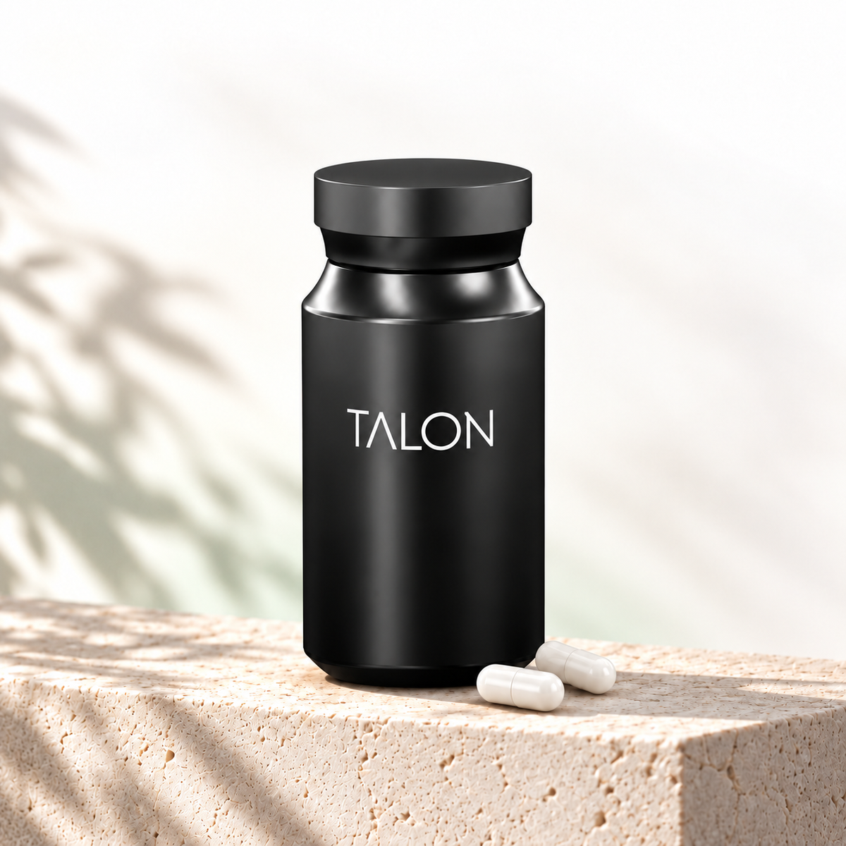 Black TALON bottle with two white capsules on a white background