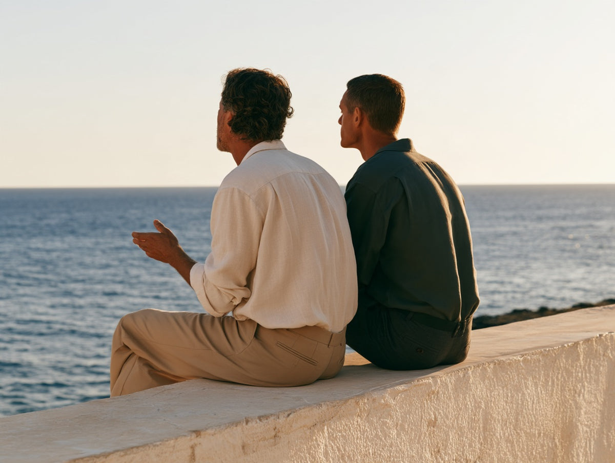 Two friends in conversation beside the sea